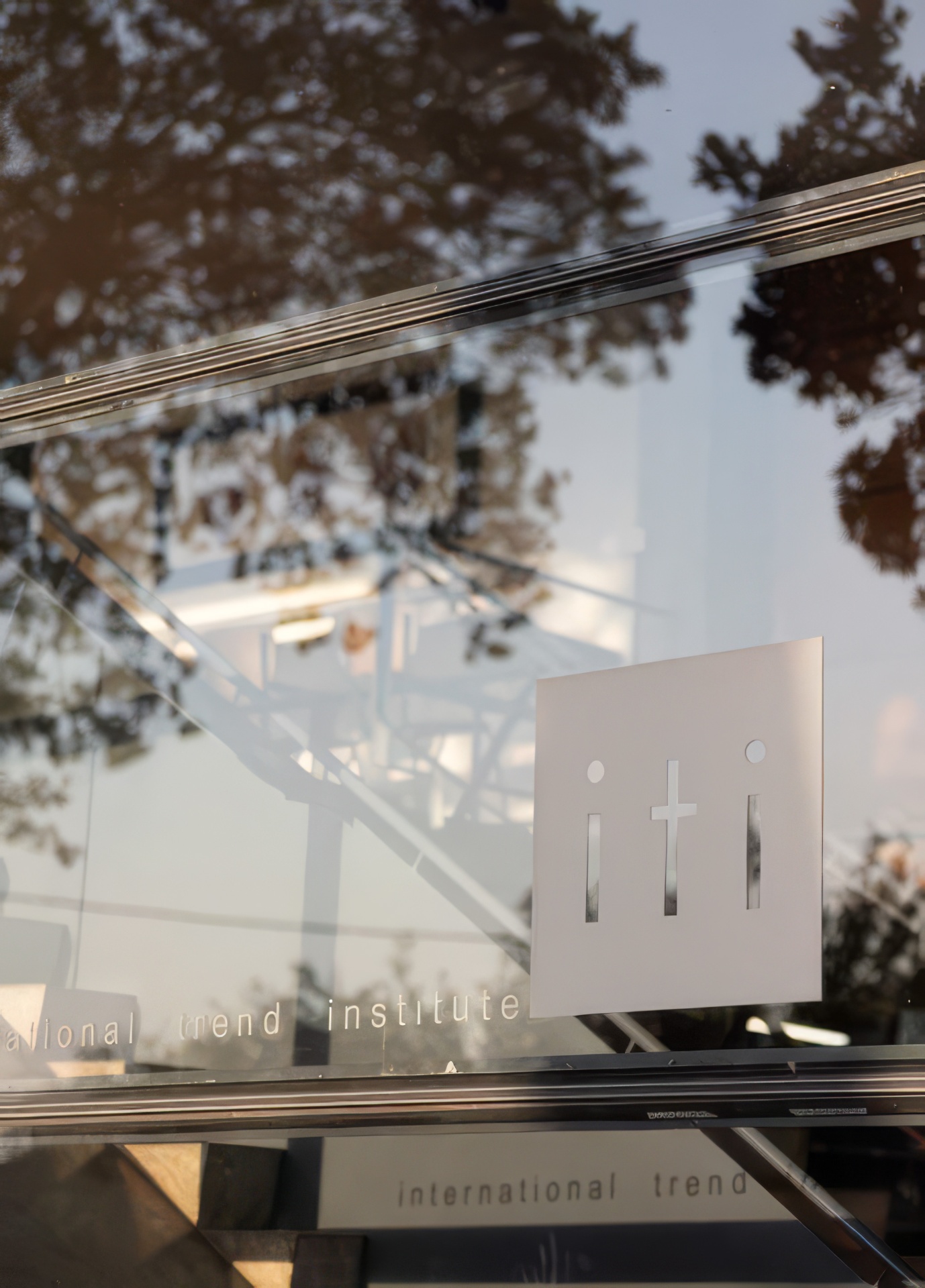 ITI signage etched on glass at the Bellevue Campus entrance
